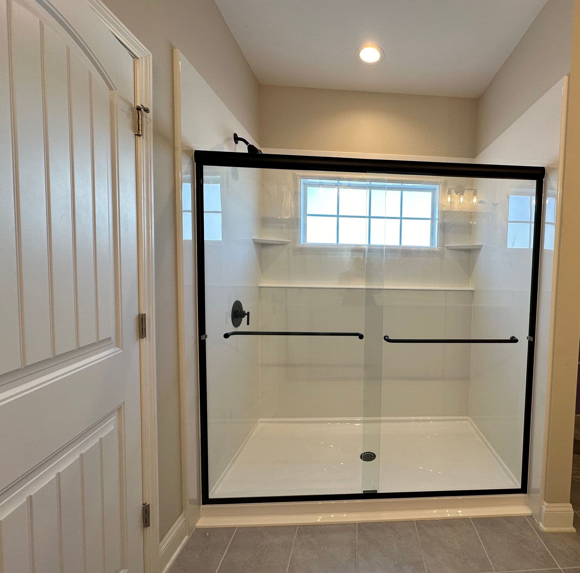 Tub to shower conversion, black hardware